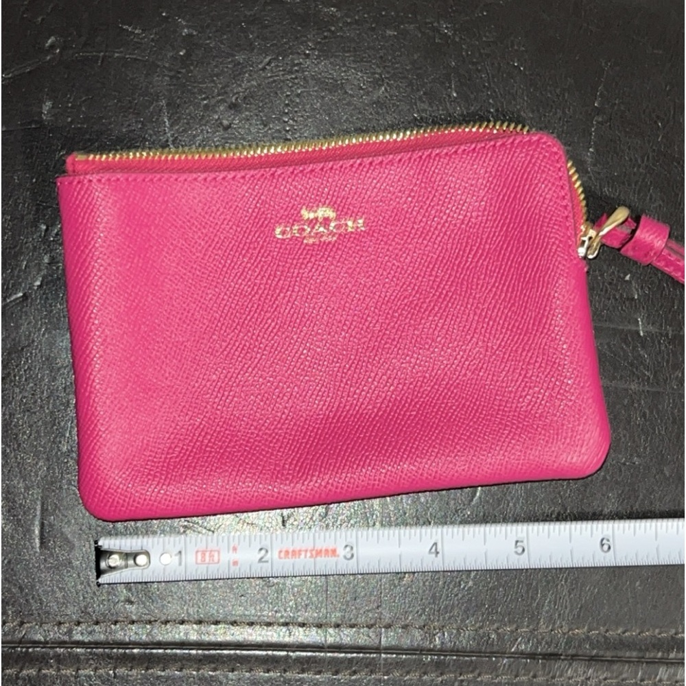 Neon pink Coach wrislet
